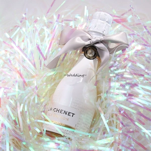 Sparkling iridescent raffia paper shreds with J.P. CHENET Ice Edition sparkling wine