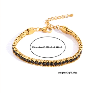 Detail view of gold tennis bracelet with black zircon stones and adjustable clasp