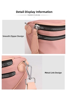 Detail of pink nylon bag featuring dual smooth zippers and durable silver metal hardware