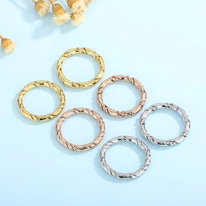 Set of six minimalist twisted rope metal rings in gold, rose gold and silver finishes