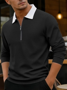 Close-up of textured waffle fabric and half-zip collar on long sleeve polo shirt