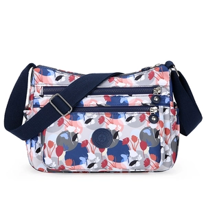 Women's nylon crossbody bag with floral pattern and multiple zipper pockets for travel