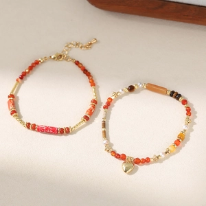 Handmade beaded bracelet set with vintage red stones and golden heart pendant charm