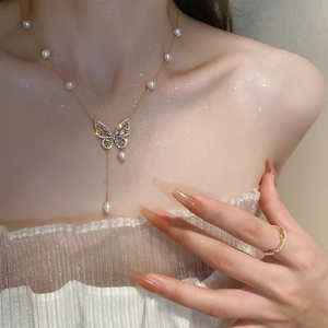 Gold plated butterfly necklace with freshwater pearls and sparkling zircons for women