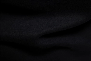 Close-up of premium black knit fabric texture for men's long sleeve sweatshirt