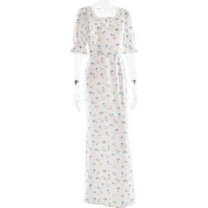 Detail of floral printed white dress showing square neckline and blue flower patterns
