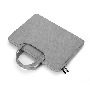 Detail of gray waterproof 14-inch laptop sleeve with dual zippers and woven handle