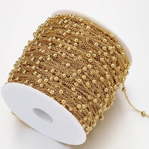 Golden stainless steel bead chain on a white spool for DIY jewelry making accessories