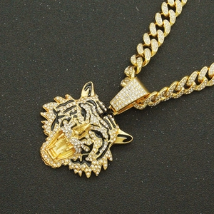 Punk hip-hop golden tiger head pendant with shiny rhinestones on a gold Cuban chain