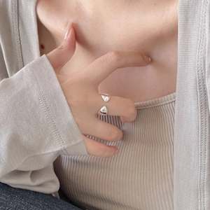 Detail of 925 sterling silver teardrop open ring on model with minimalist design
