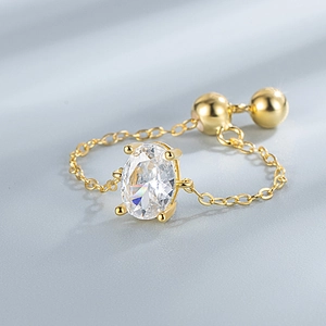 Elegant S925 sterling silver chain ring with large oval clear gemstone in gold finish