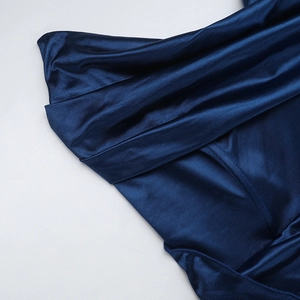 Detailed view of deep blue satin fabric with a subtle grid texture and silky luster
