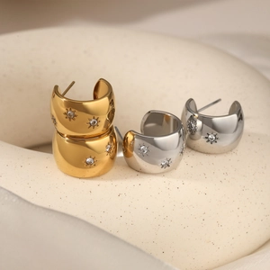 Wide C-shaped stainless steel earrings with starburst zircon engraving in gold and silver