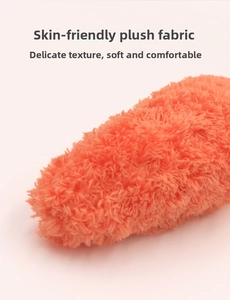 Close-up macro view of the skin-friendly orange plush fabric texture for pet toys