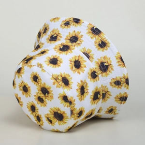 White bucket hat with all-over sunflower print for summer sun protection
