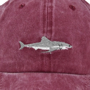 Burgundy washed cotton baseball cap with detailed grey shark embroidery and distressed texture