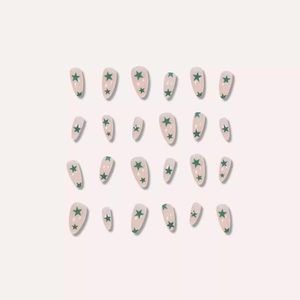 Set of 24 press-on nails in long almond shape with green stars on pale pink base