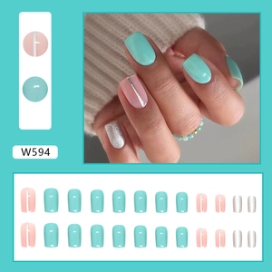 Medium-length square press-on nails in mint green and pink with silver glitter accents