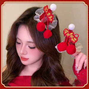 New Year red cherry hair clip with festive embroidery and plush white pom-poms