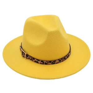 Detail of yellow fedora hat featuring a leopard print belt and golden square buckle