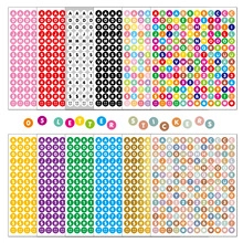 Close-up of colorful round alphabet and number stickers for spice jars and scrapbooking