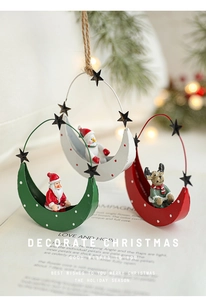 Detail of Christmas iron moon pendants with Santa, Snowman and Reindeer figurines