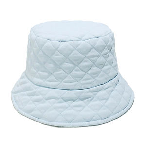 Detail of light blue quilted bucket hat with diamond stitching and soft fabric texture
