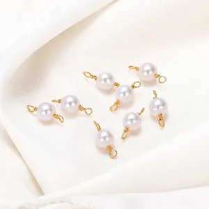 18K gold-plated pearl connectors with wire wrapping for DIY jewelry on white satin