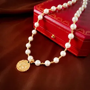 Vintage gold plated portrait pendant pearl necklace set on luxury jewelry gift box