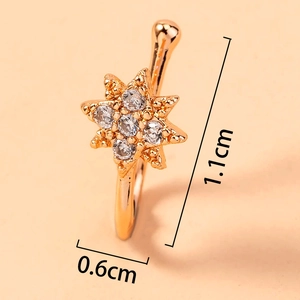 Macro shot of rose gold star clip-on nose ring with crystal inlay and size dimensions