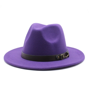 Detail of purple wool fedora hat with brown leather band and gold horsebit buckle
