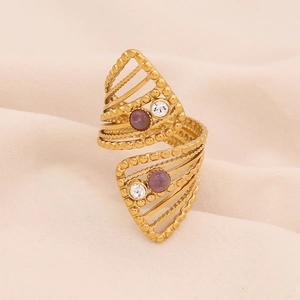 Detailed macro of gold vintage geometric ring with purple amethyst and clear stones