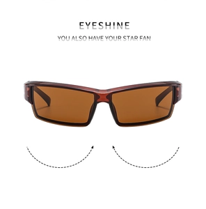 Detail of Y2K cycling sunglasses with dark brown frames and gradient brown lenses