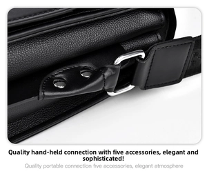 Close-up of silver metal hardware and lychee texture on black PU leather bag