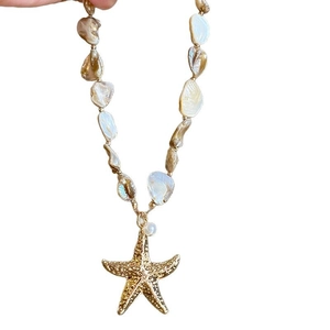 Elegant gold starfish pendant necklace with natural shell and baroque pearl beads