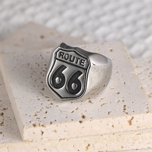 Men's silver Route 66 shield ring in titanium steel on stone background
