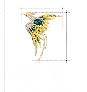 Detail view of colorful phoenix brooch with dimensions 5.7x6.1cm and rhinestone inlay