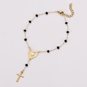 Detail shot of golden 304 stainless steel rosary bracelet with heart and cross charms