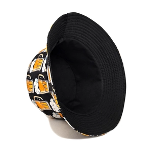 Close-up of black bucket hat with vibrant yellow beer glass prints and durable cotton texture