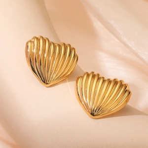 18K gold plated heart stud earrings with striped texture on soft beige silk background