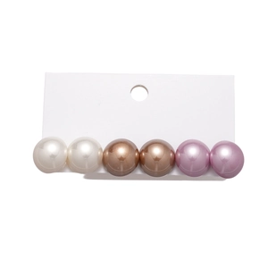 Set of 6 geometric faux pearl stud earrings in white, brown and purple on display card