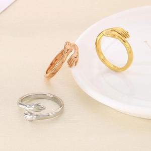 Adjustable hugging hands open rings in gold, rose gold, and silver polished finishes