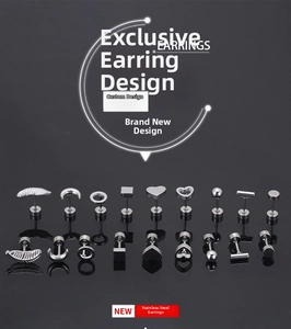 Detailed view of various stainless steel geometric stud earrings on a dark surface