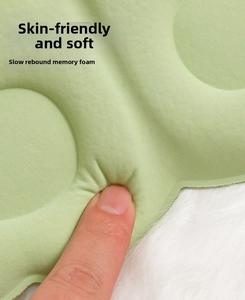 Detail view of green 3D memory foam sleep mask showing soft texture and slow rebound design.
