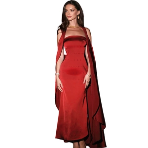 Close-up of elegant red satin strapless evening gown with matching long shawl set