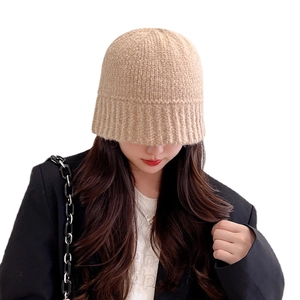 Beige knit bucket hat for women crafted from warm yarn for autumn and winter fashion