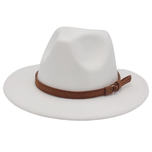 Close-up of white wool fedora hat featuring a brown faux leather band with gold buckle