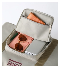 Interior layout of the gray-green travel bag showing compartments for daily accessories