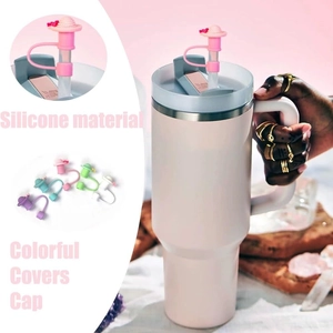 Detail showing five colors of silicone butterfly straw caps for large insulated tumblers