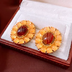 Vintage oval agate stud earrings in sunflower design with gold finish and yellow beads